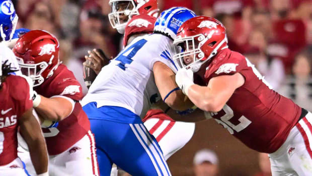 Razorbacks' Brady Latham blocking a BYU defender in Saturday night's game